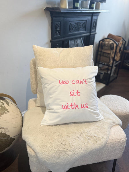 White cushion cover with pink mean girls quote