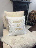 White cushion cover with ‘comfy as fuck’ in beige