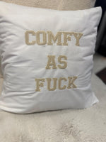 White cushion cover with ‘comfy as fuck’ in beige