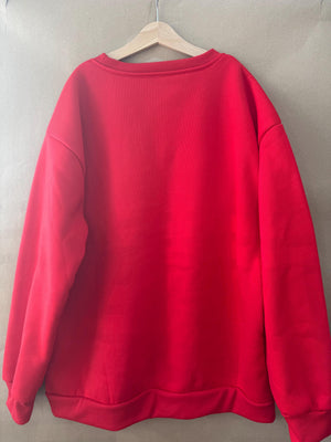 Christmas jumper in red, ‘Oh baubles’ embroidered in gold