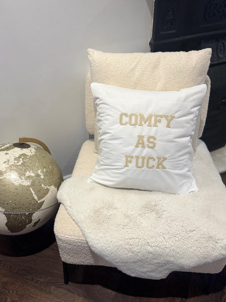 White cushion cover with ‘comfy as fuck’ in beige