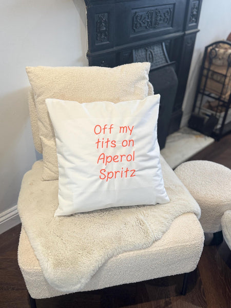 White cushion cover with funny quote embroidered in orange