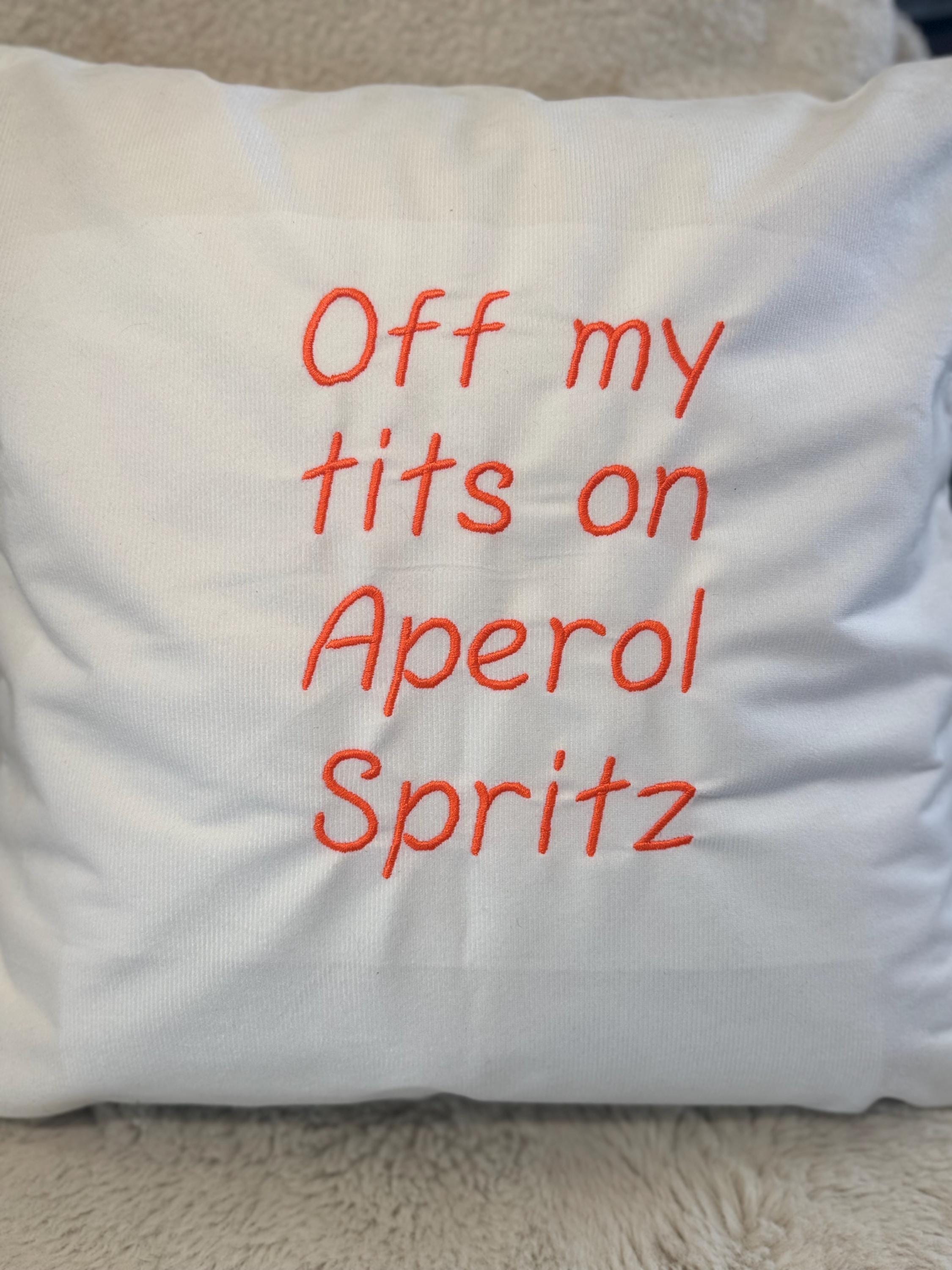 White cushion cover with funny quote embroidered in orange