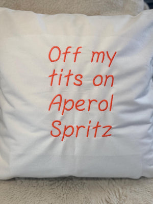 White cushion cover with funny quote embroidered in orange