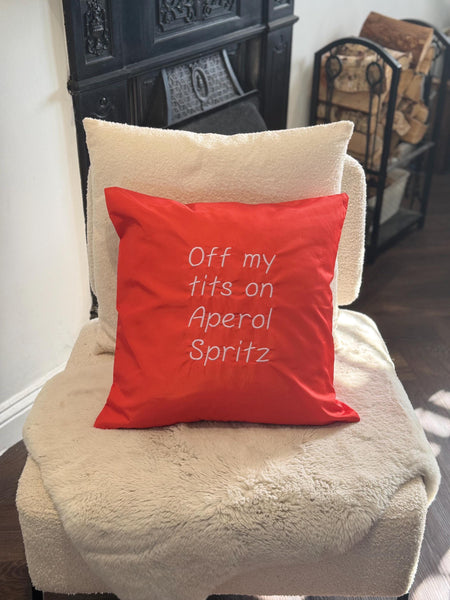 Orange square outdoor cushion cover with funny quote embroidered in white
