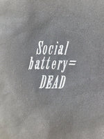 Black tote bag with ‘Social battery= DEAD’ embroidered in white.